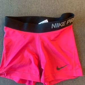 Nike Pro Pink w\ black waist band shorts. New-like condition. Size Small